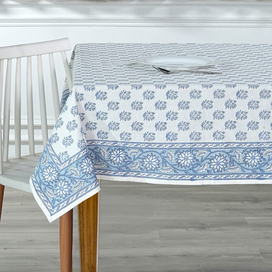 Tablecloth with blue floral pattern on a wooden table
