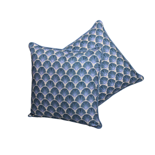 Pair of blue patterned pillows on a white background