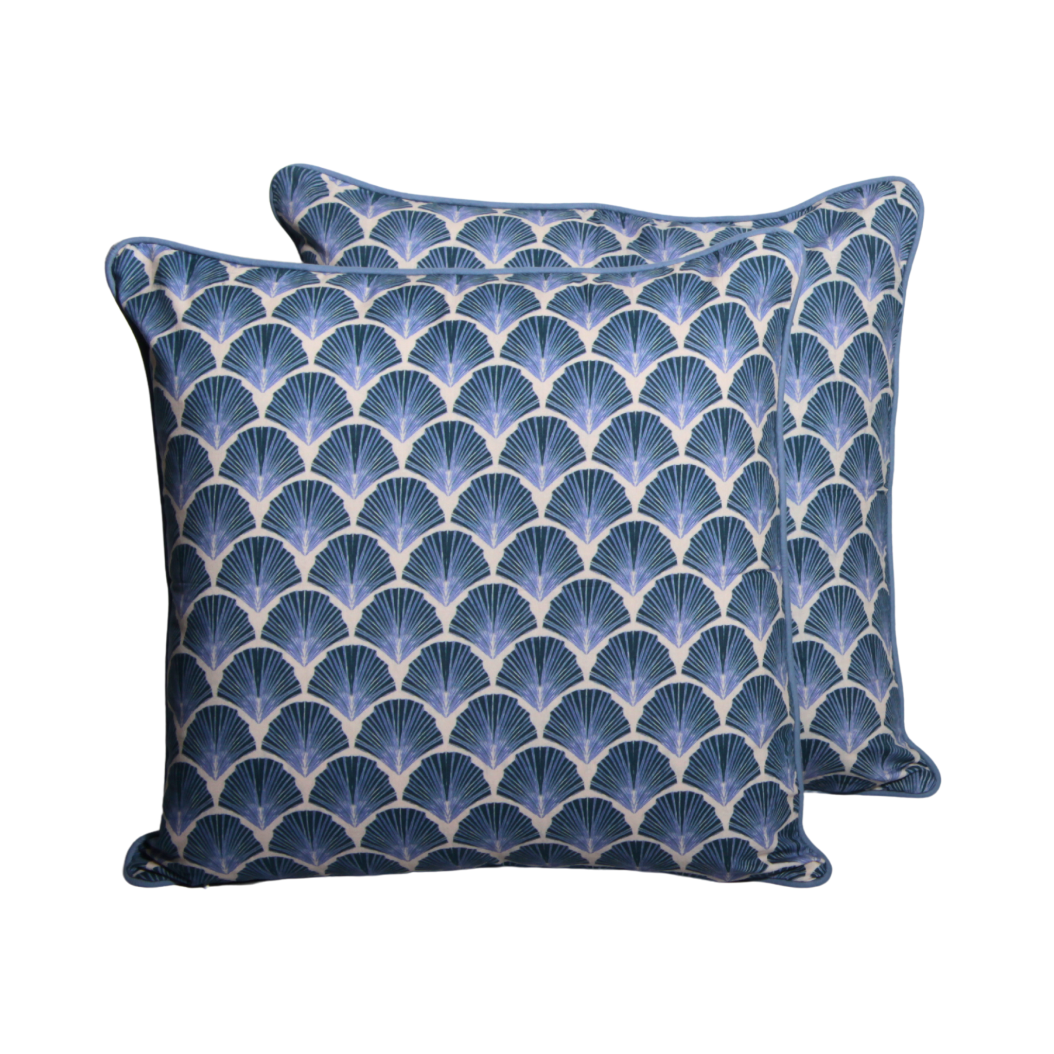 Two blue patterned pillows on a white background