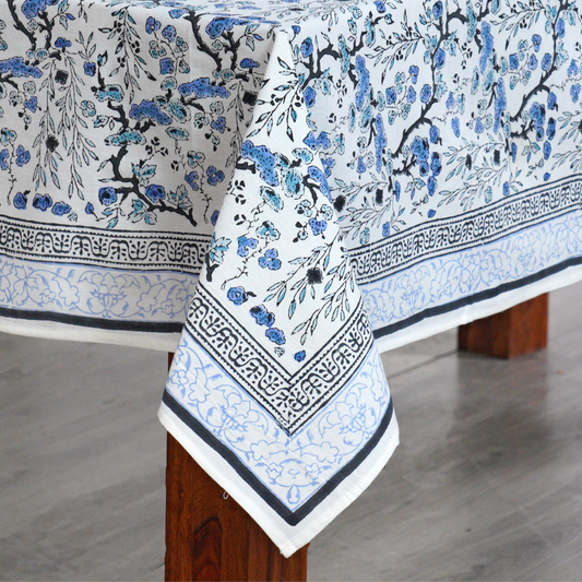 Floral patterned tablecloth on a wooden table