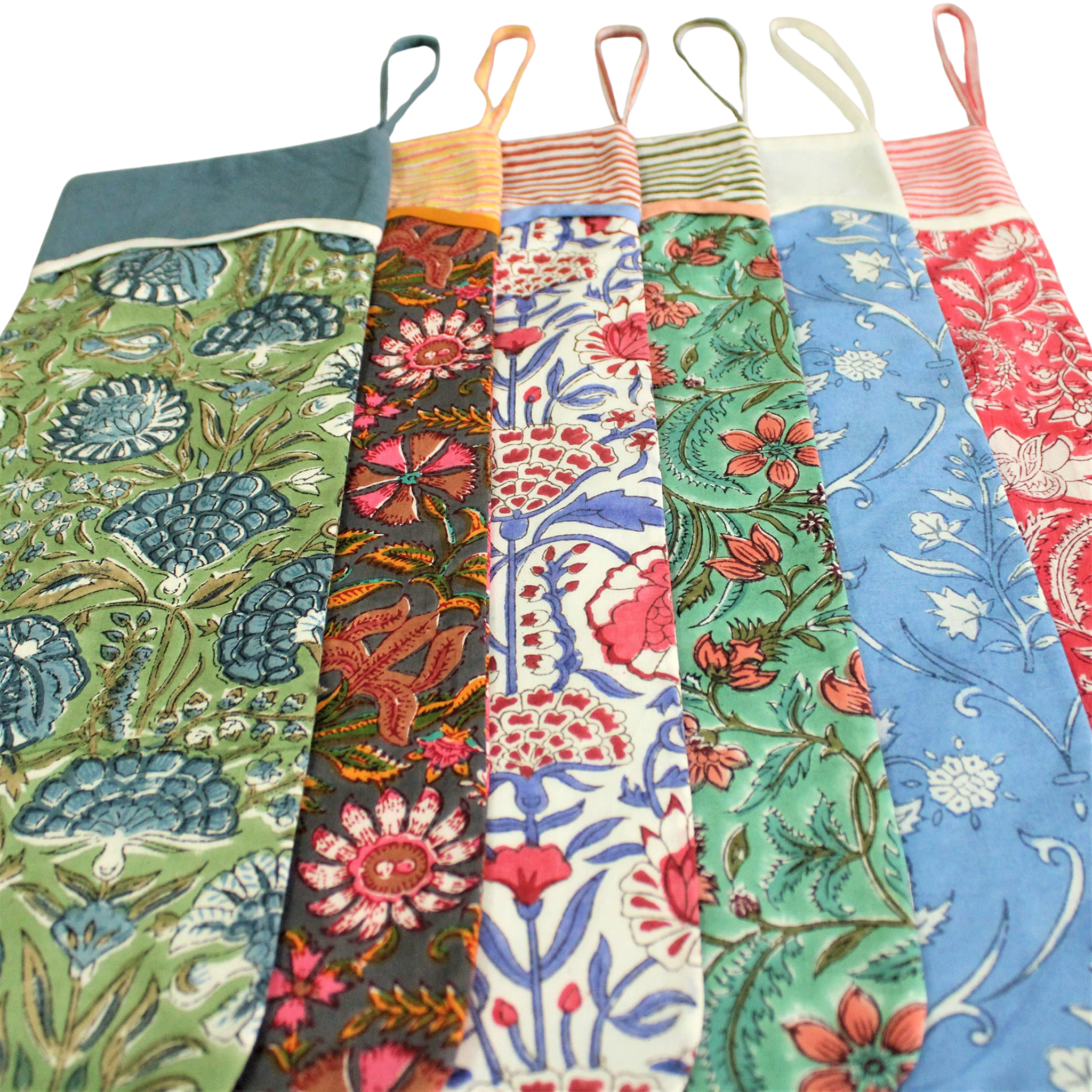 Set of colorful aprons with floral patterns on a white background