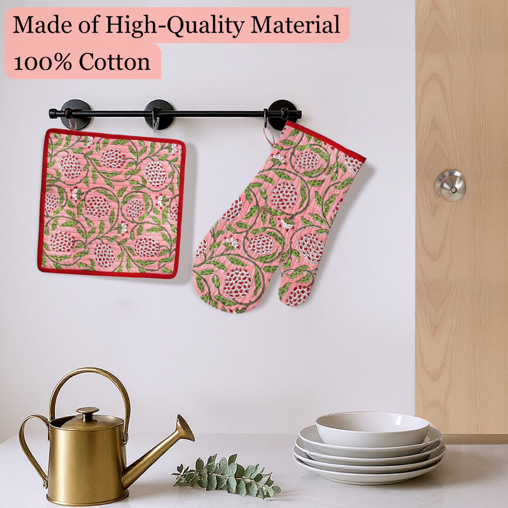 Patterned pot holder and oven mitt hanging on a rack with kitchen items below.