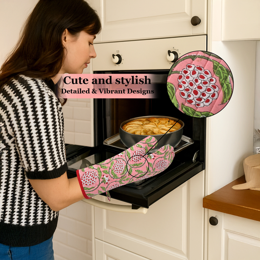 Woman wearing a pink floral oven mitt and glove, opening an oven with a dish inside.