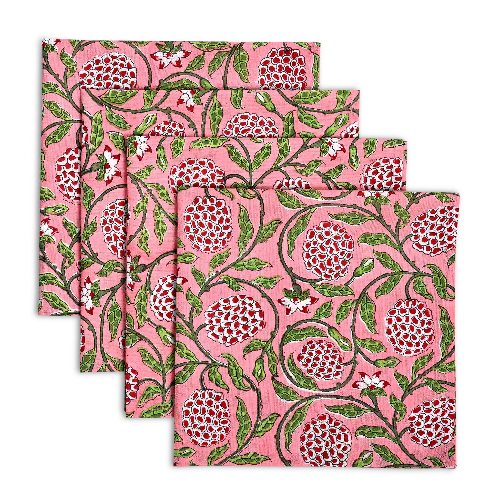 Set of four pink floral patterned napkins on a white background