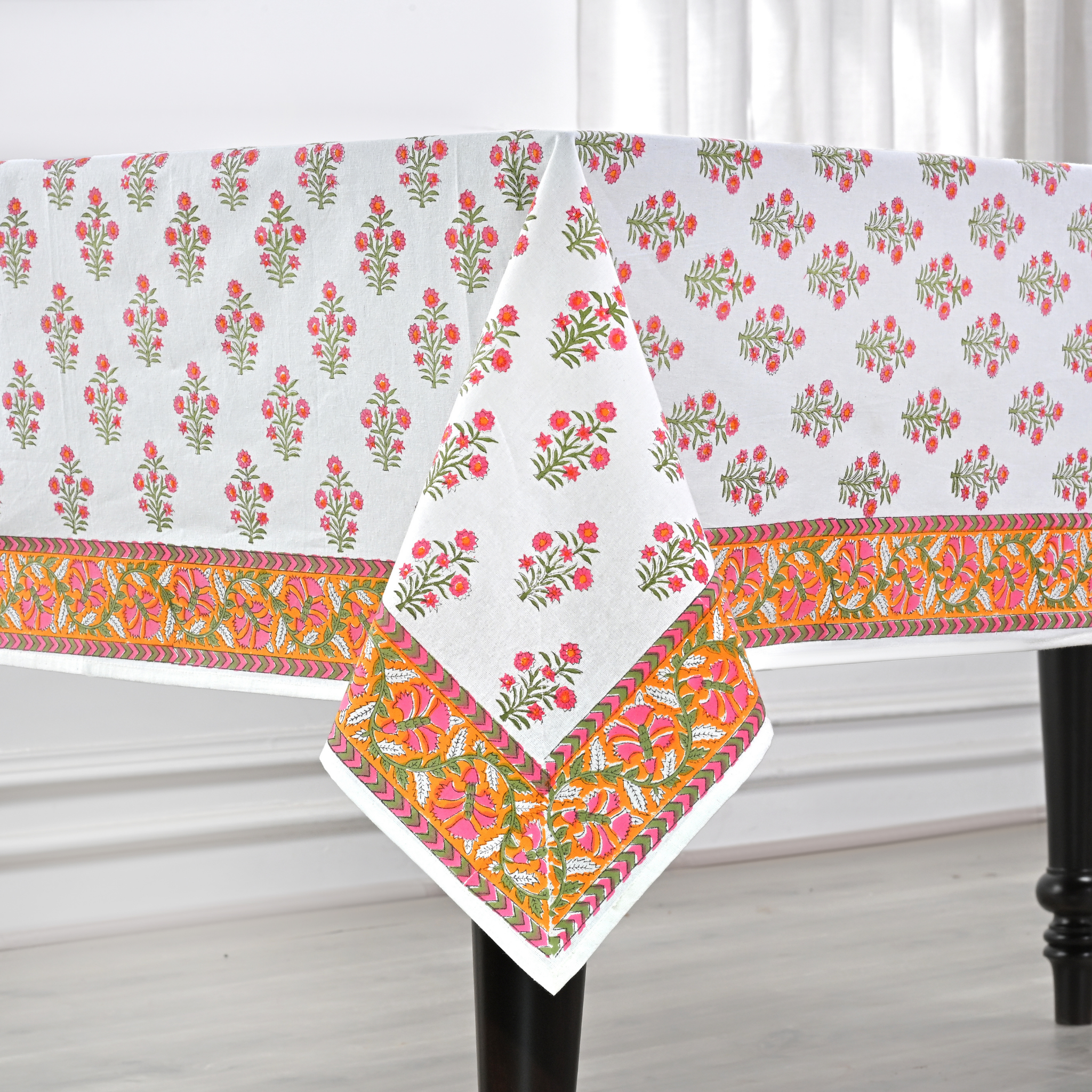 Decorative tablecloth with floral pattern on a white background