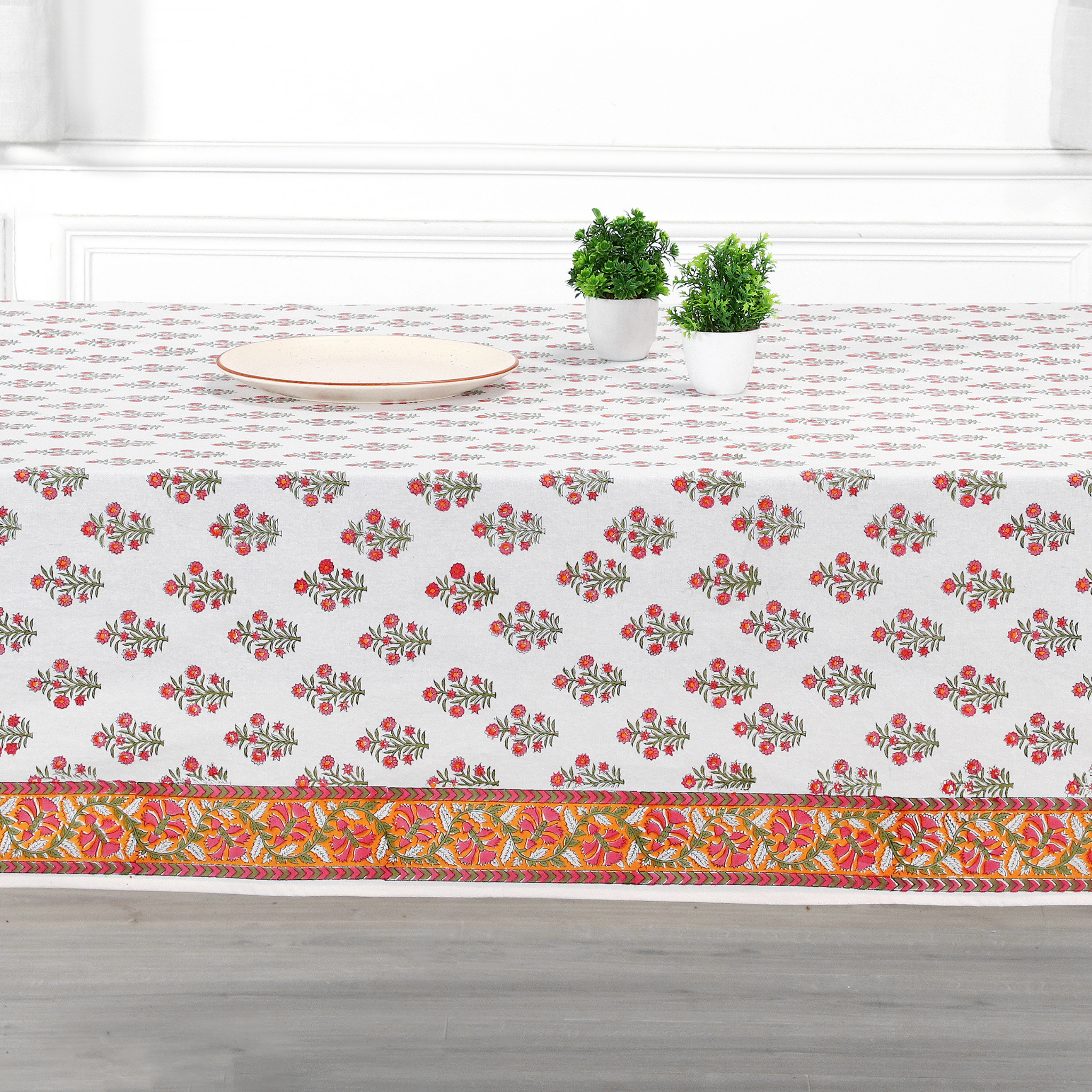 Decorative tablecloth with floral pattern on a kitchen counter.