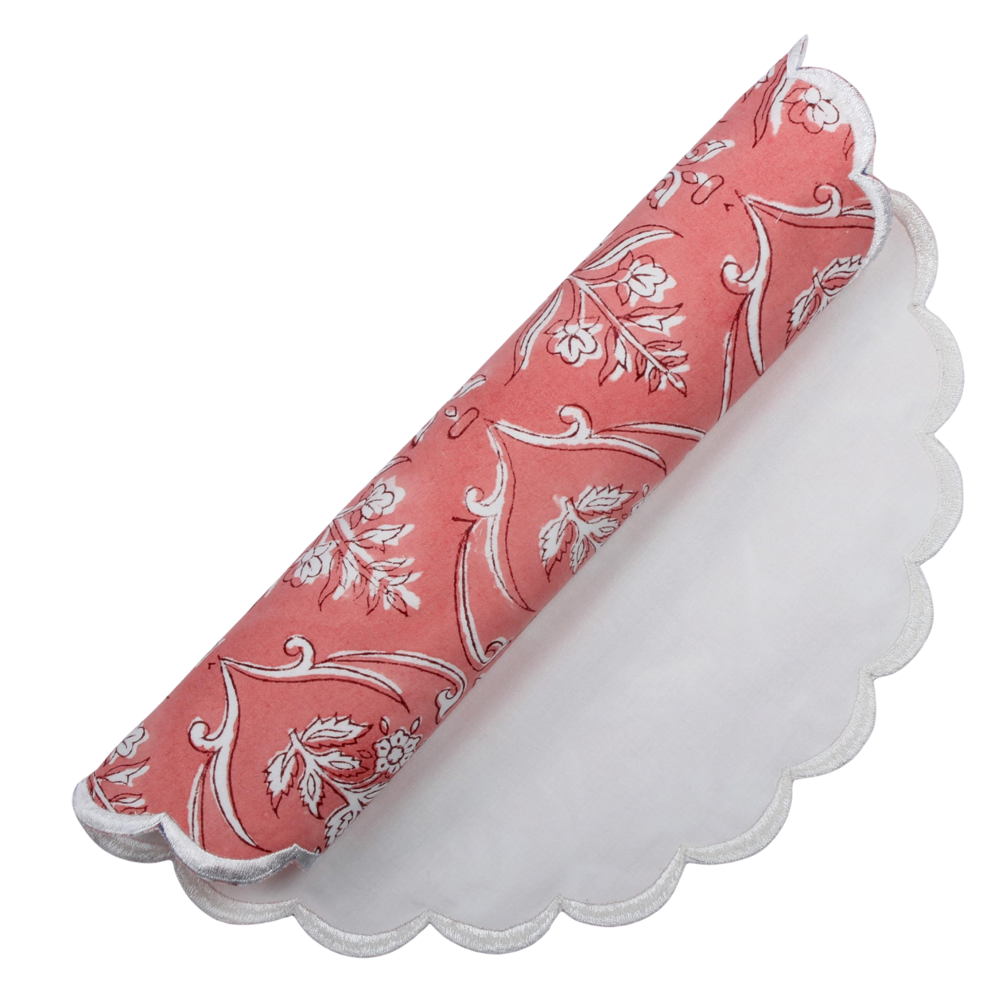 Decorative pink and white patterned napkin with scalloped edge on a white background