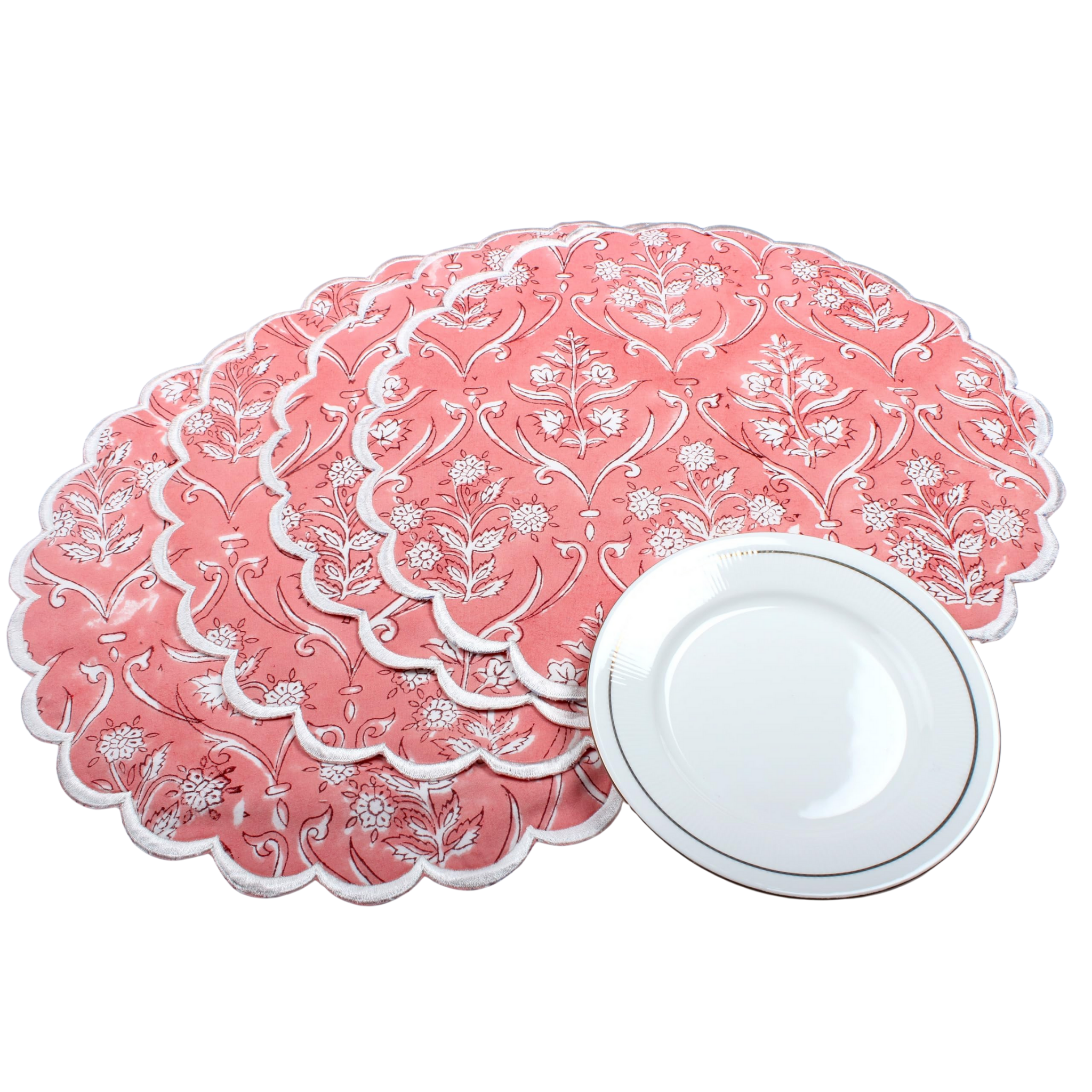 Set of pink placemats with white floral patterns on a white background