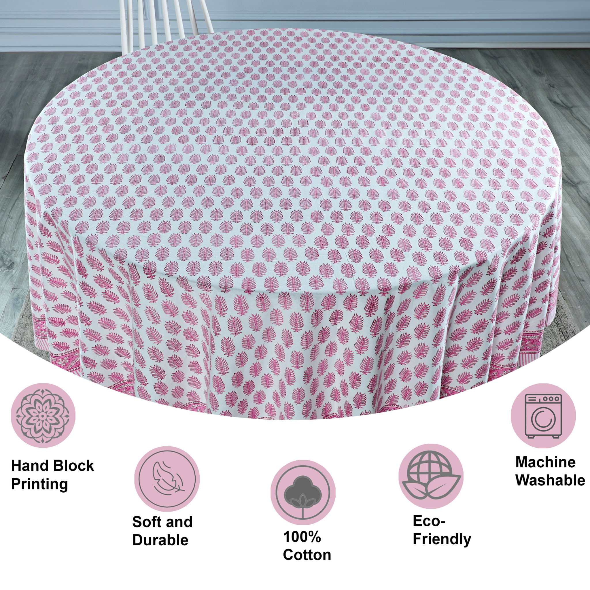 Round tablecloth with pink floral pattern on a wooden table, with features listed below.