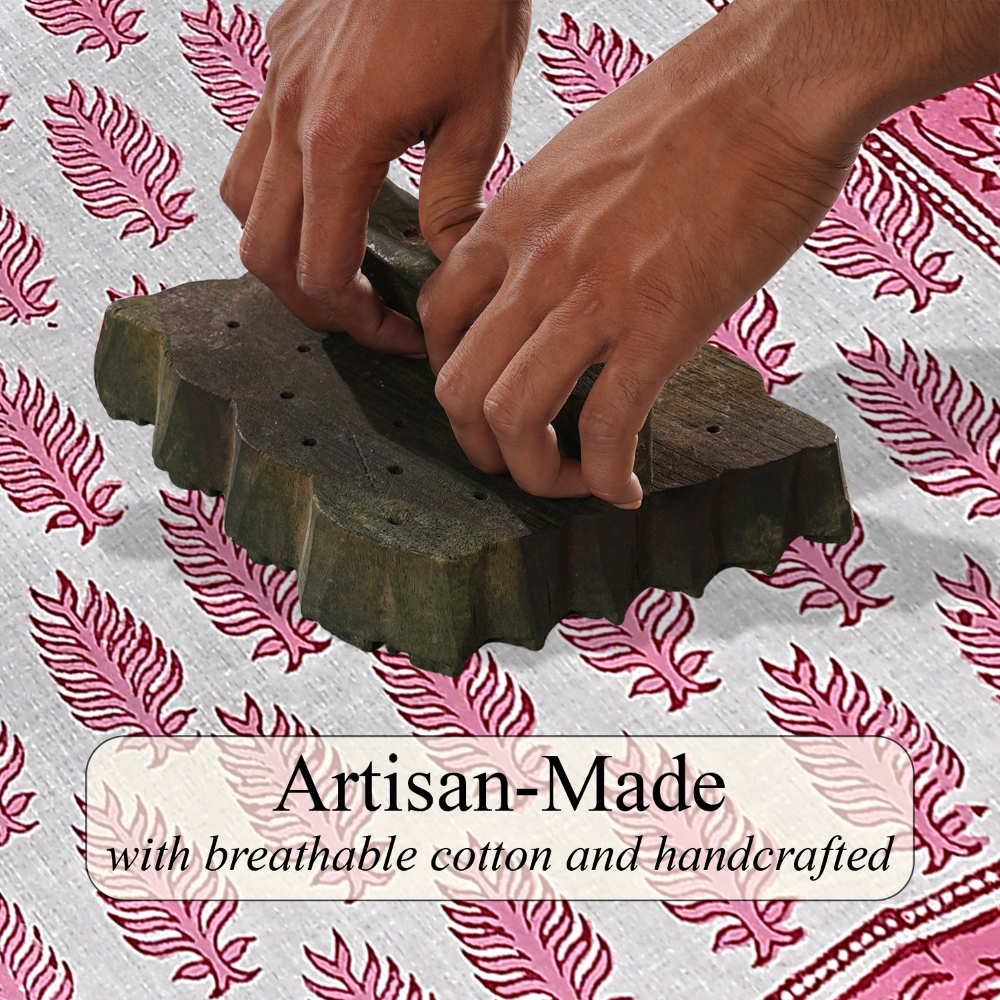 Hands using a wooden tool on a textured surface with pink feather pattern