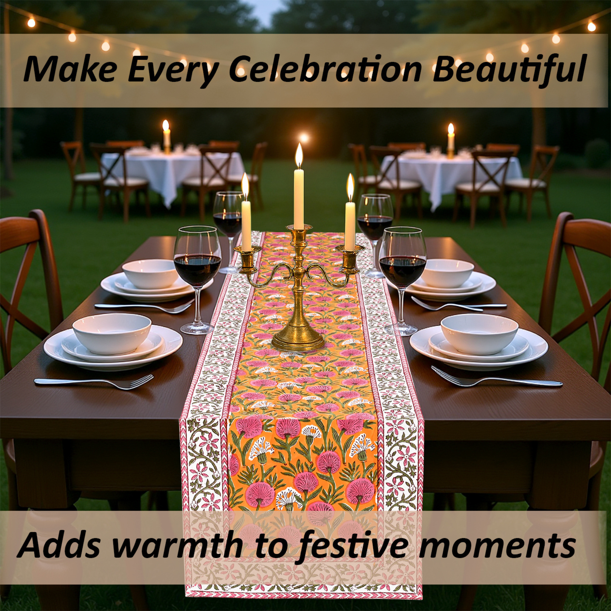 Dining table set with a decorative table runner, candles, and wine glasses outdoors.