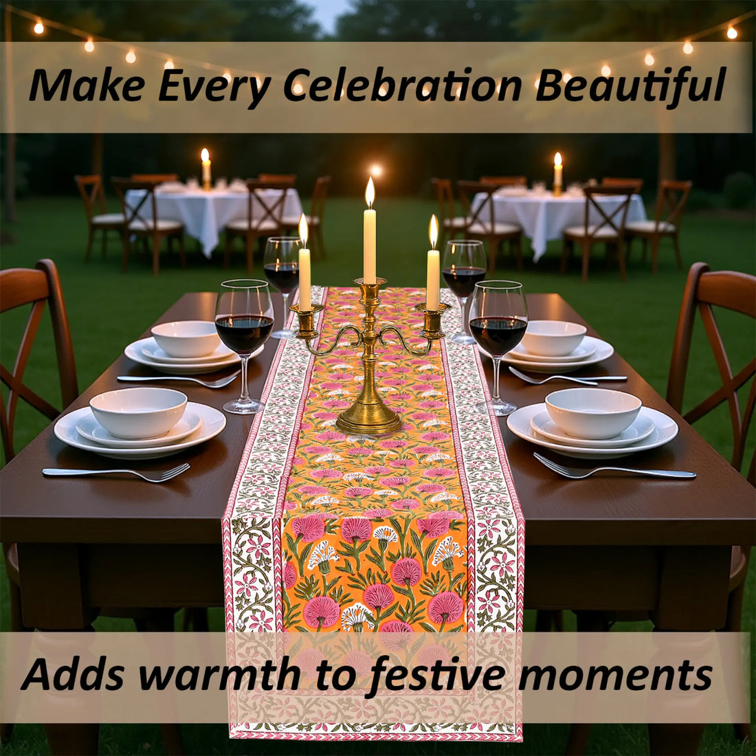 Dining table set with a decorative table runner, candles, and wine glasses outdoors.