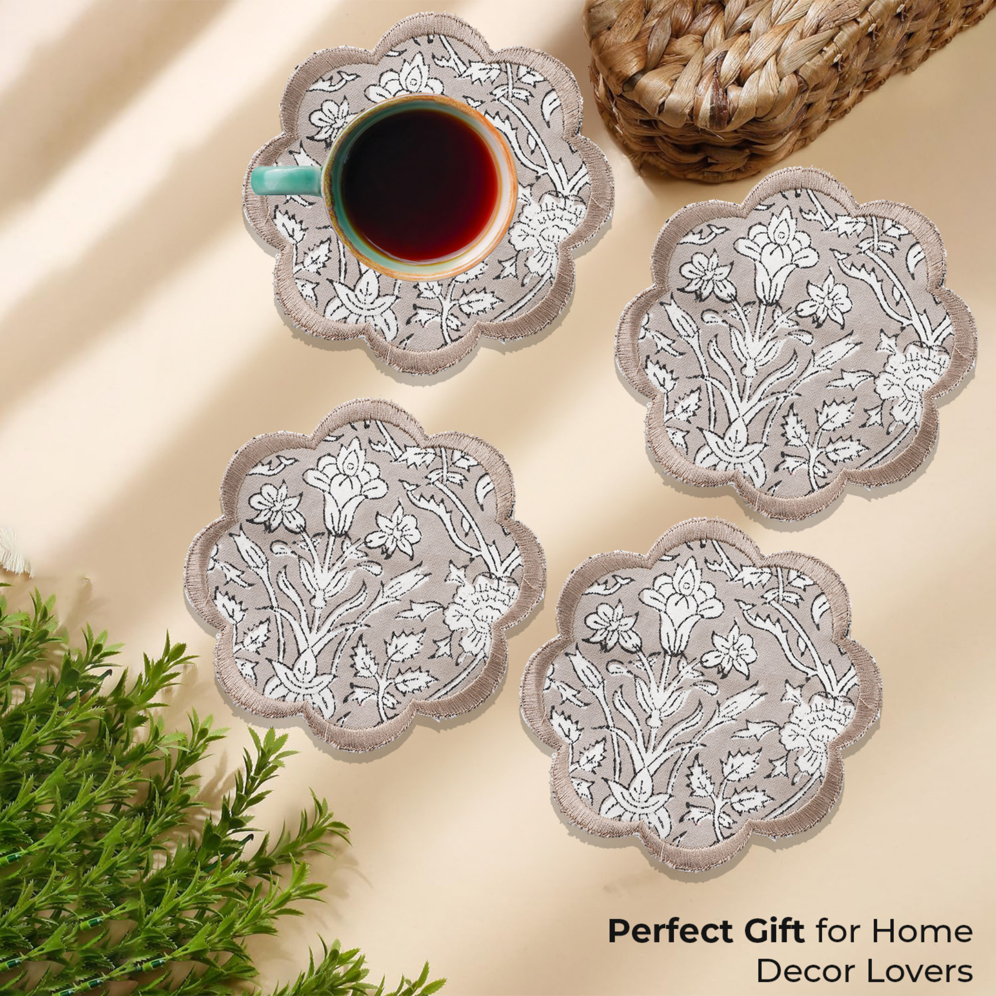 Set of floral coasters with a cup of coffee on a beige surface, accompanied by text 'Perfect Gift for Home Decor Lovers'.