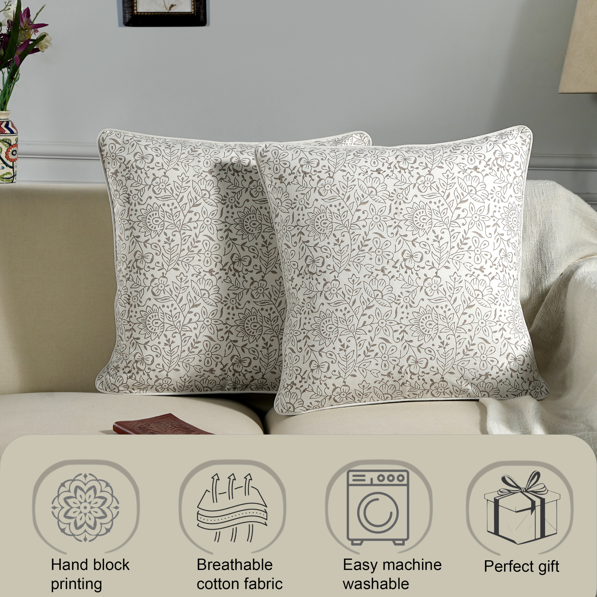 Decorative pillows with floral pattern on a sofa, featuring icons and text about product features.