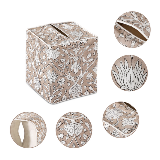 Decorative box with floral patterns and matching rings on a white background