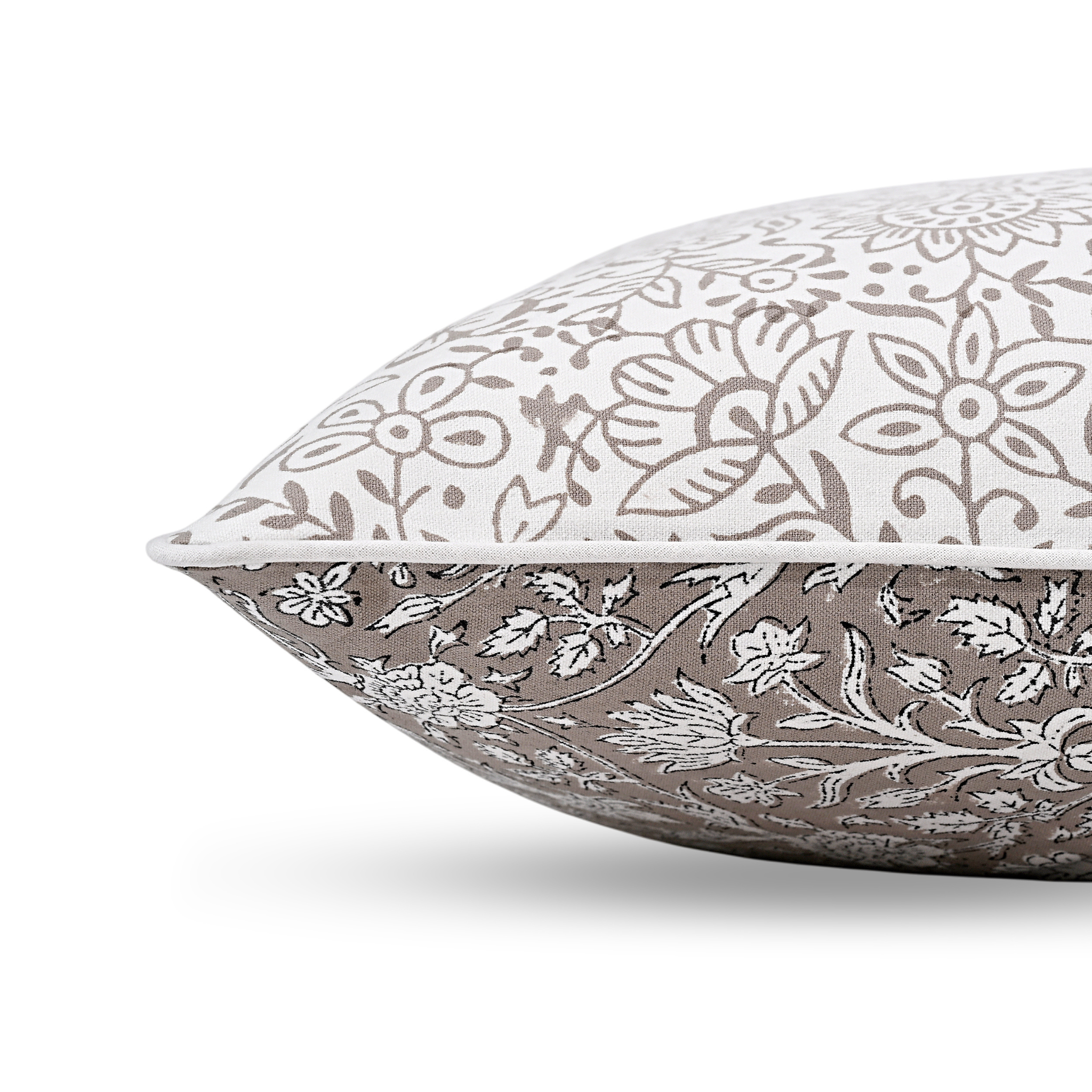 Two patterned pillows on a white background
