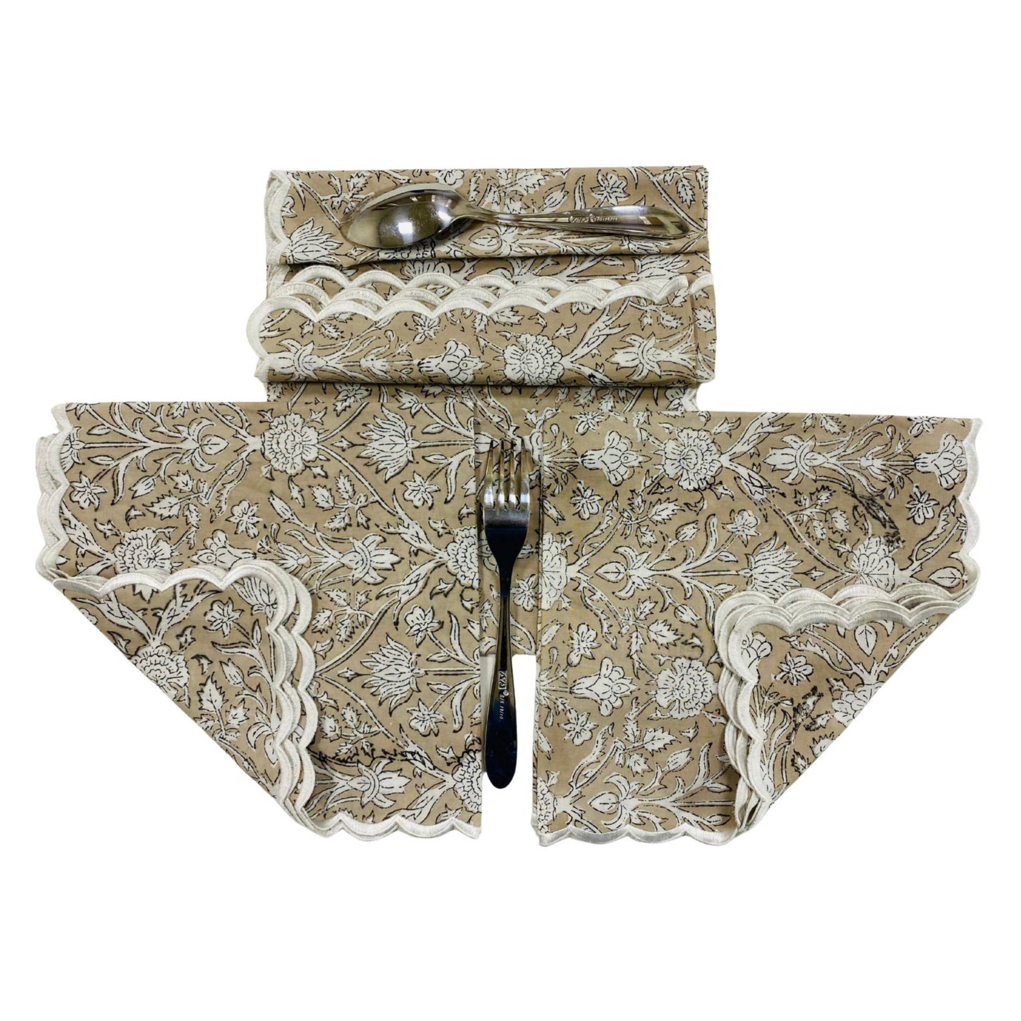 Decorative table runner with floral pattern and lace trim on a white background