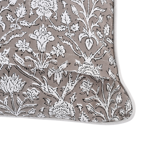 Floral patterned fabric with white flowers on a gray background
