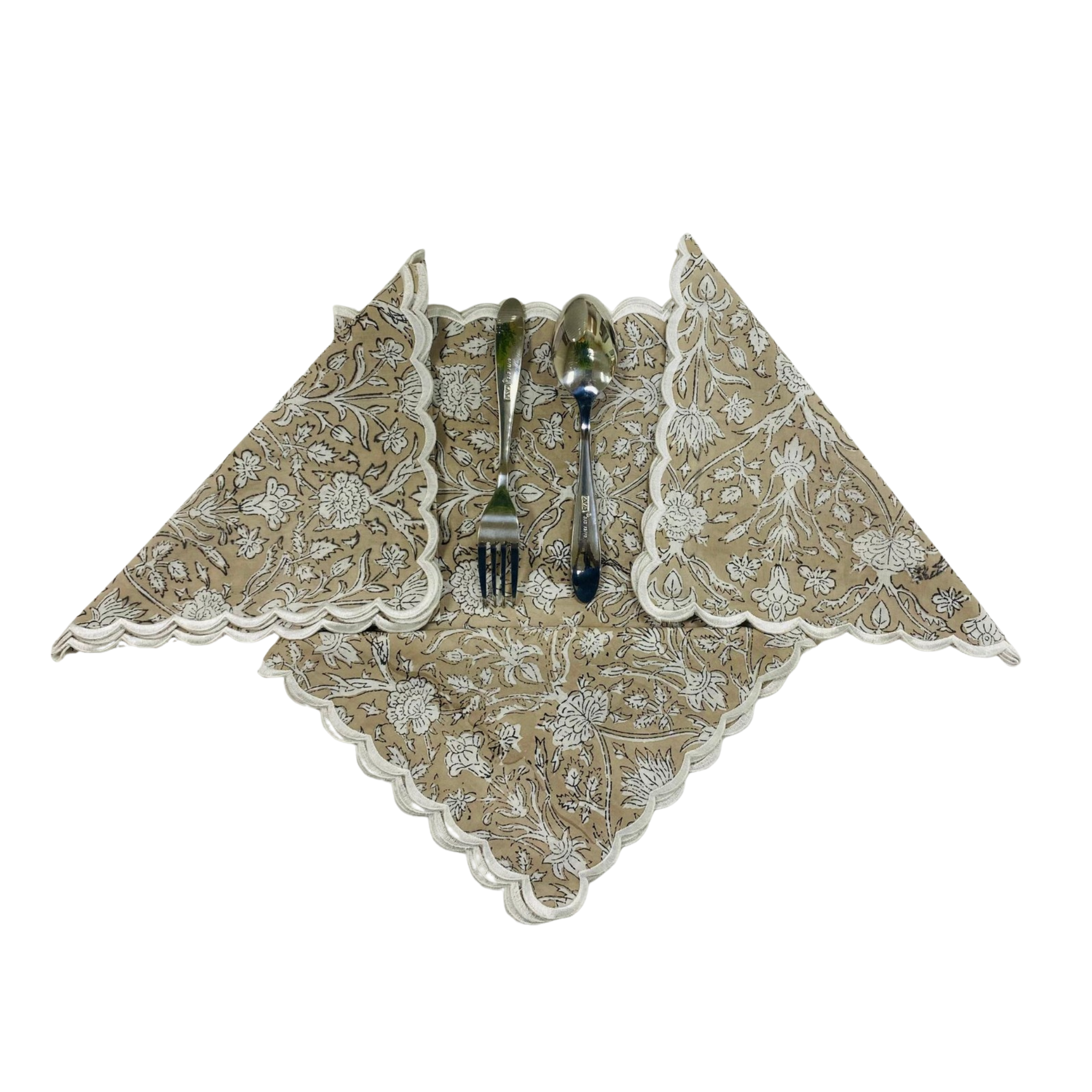 Decorative napkin with floral pattern holding a fork and spoon on a white background