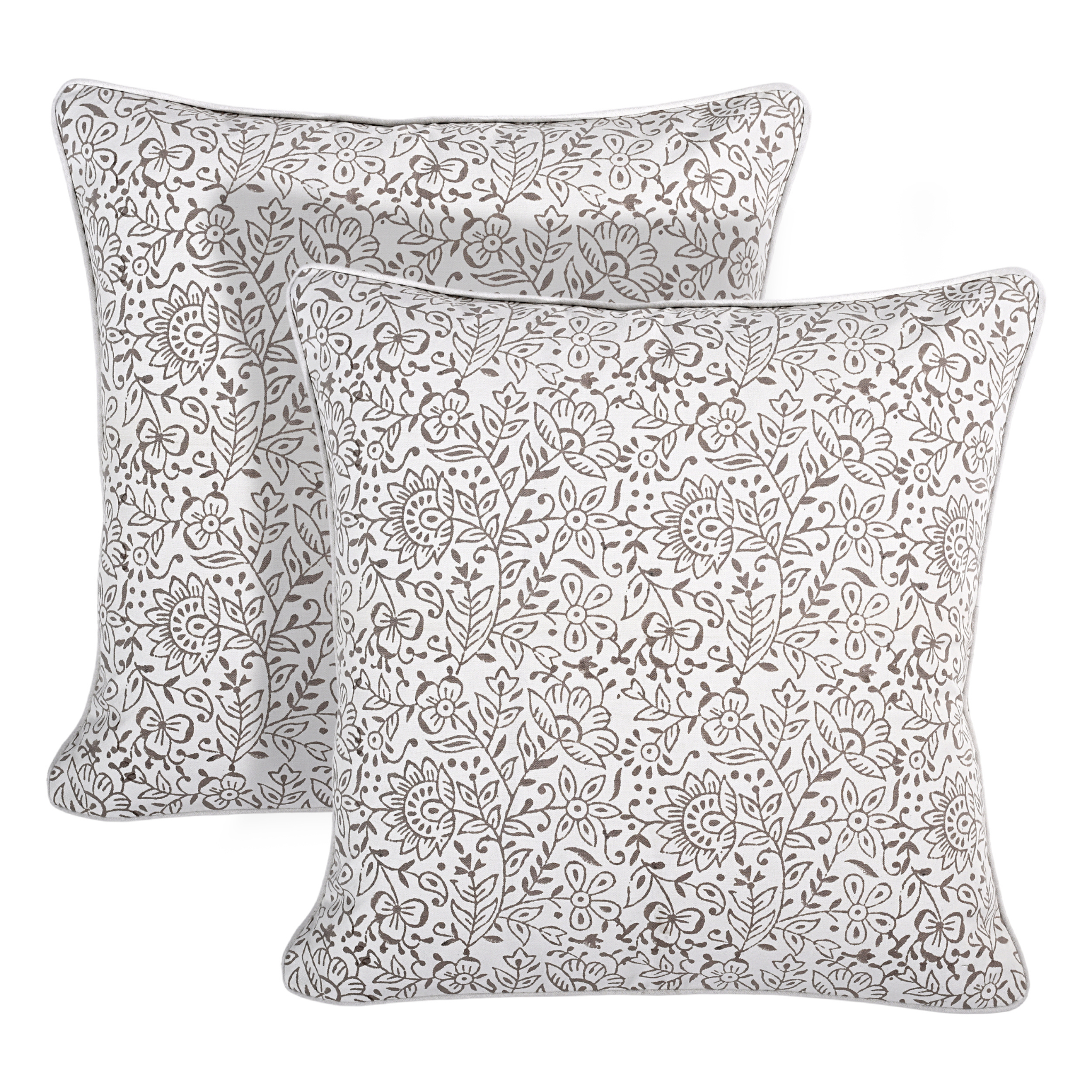 Two decorative pillows with floral patterns on a white background