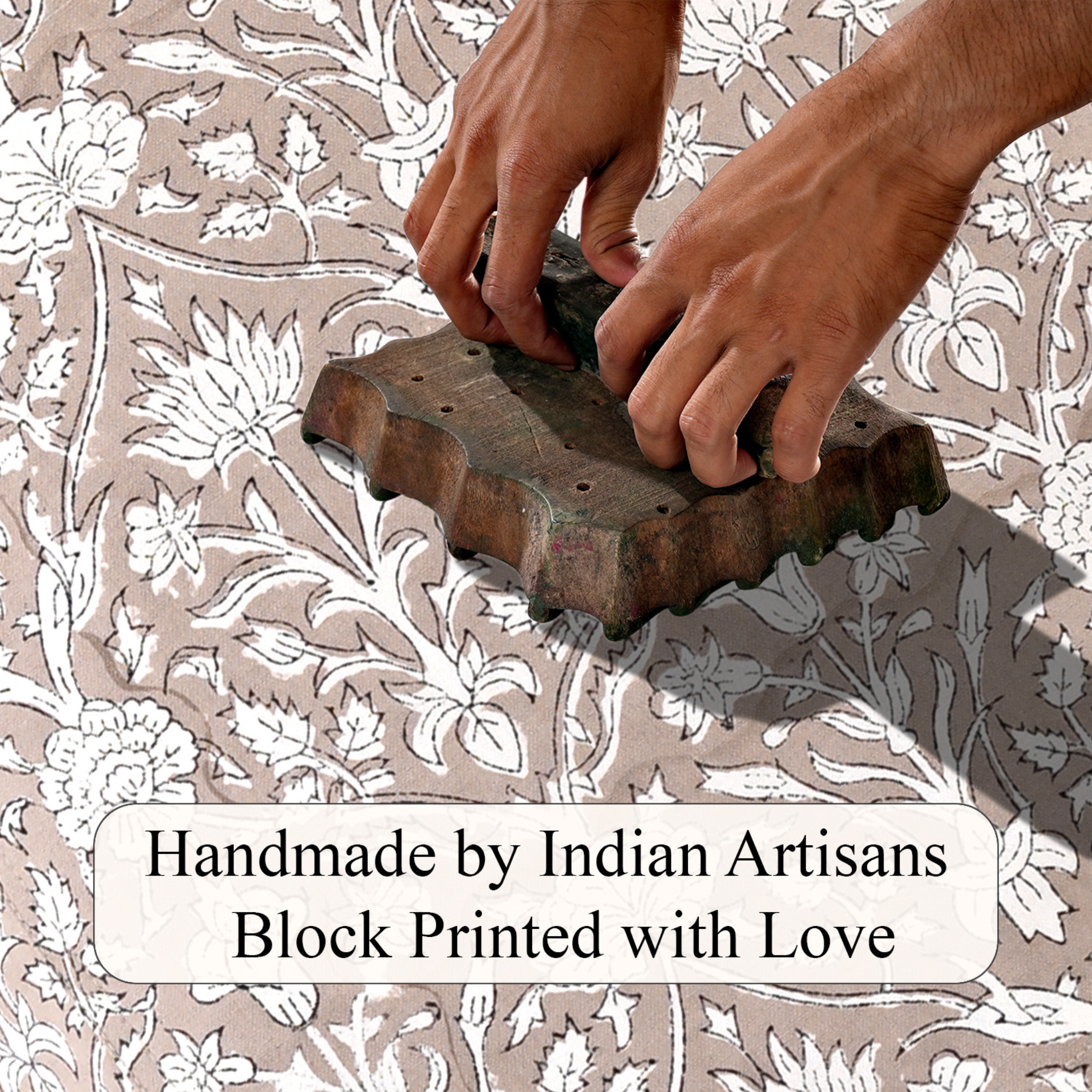 Hand block printing on fabric with text 'Handmade by Indian Artisans Block Printed with Love'.