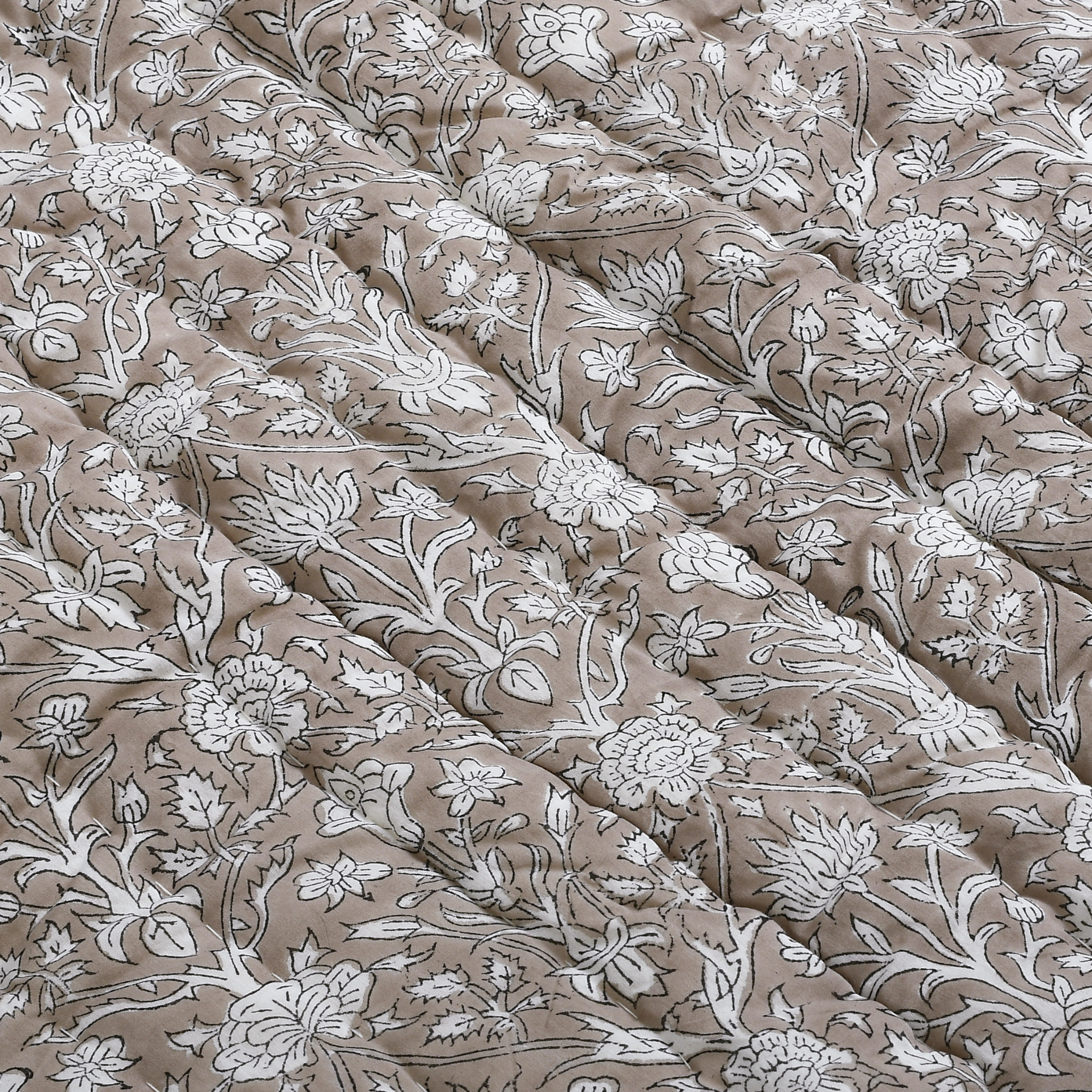 Floral patterned fabric with beige and white colors