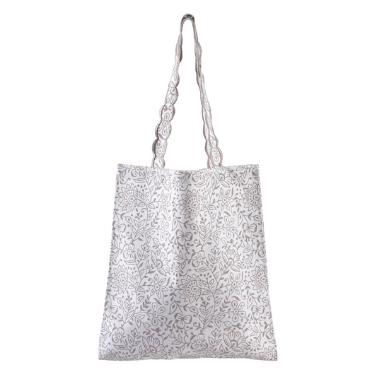 White tote bag with black floral pattern on a white background