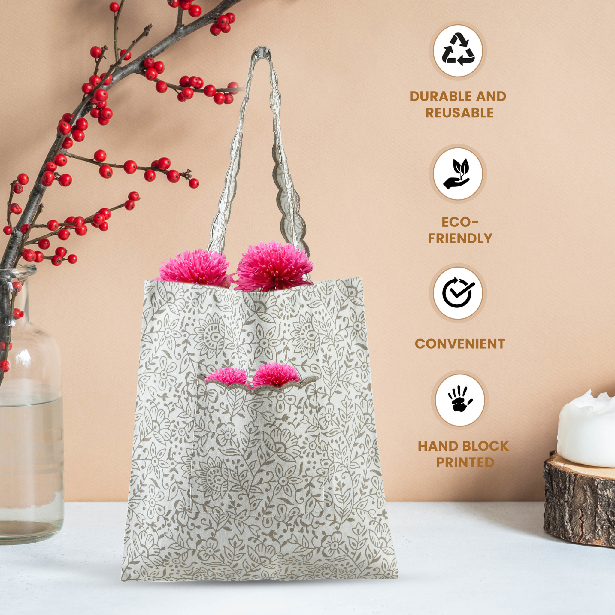Reusable tote bag with pink pom-poms on a neutral background with eco-friendly icons and text.