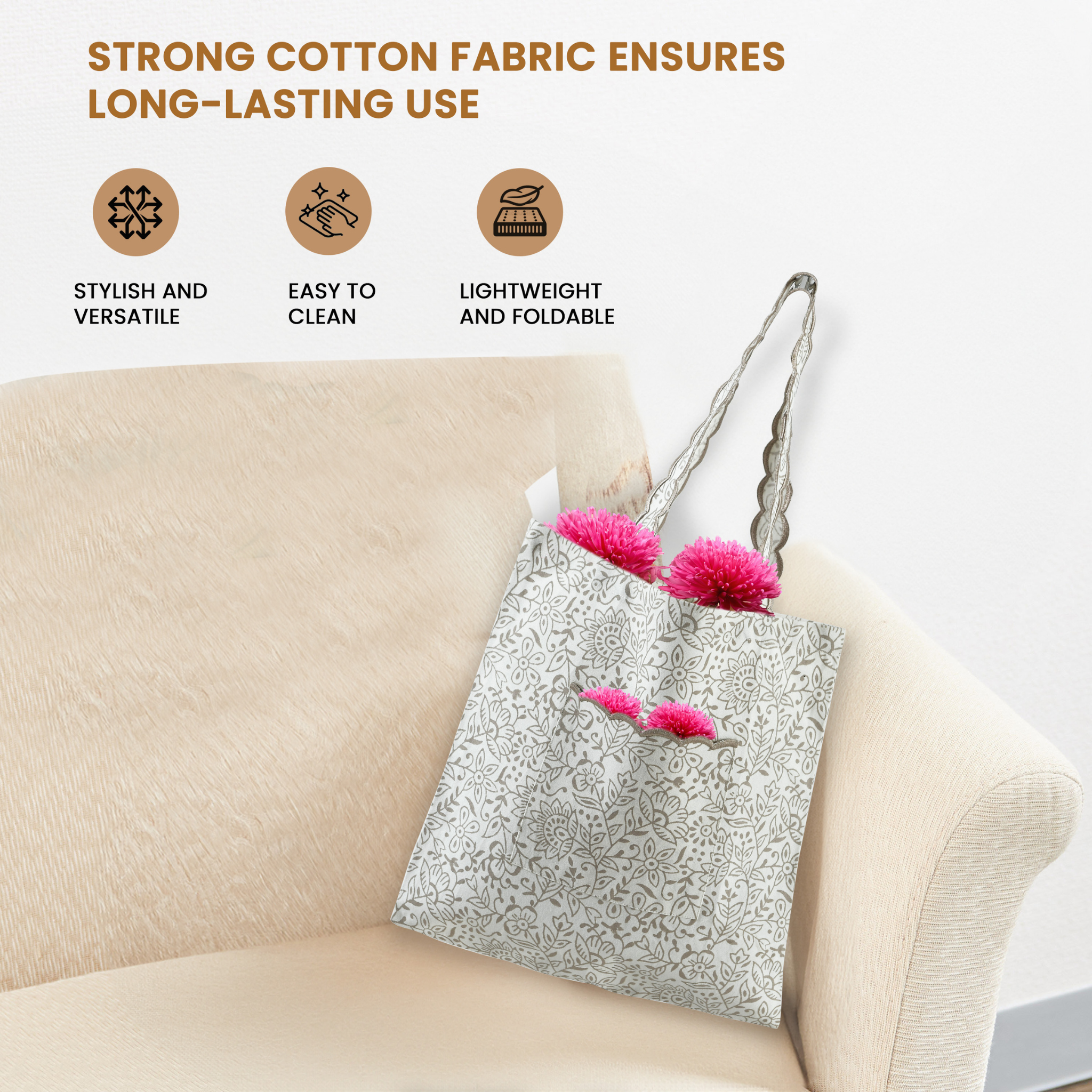 Tote bag with pink pom-poms on a beige couch, featuring text about strong cotton fabric.