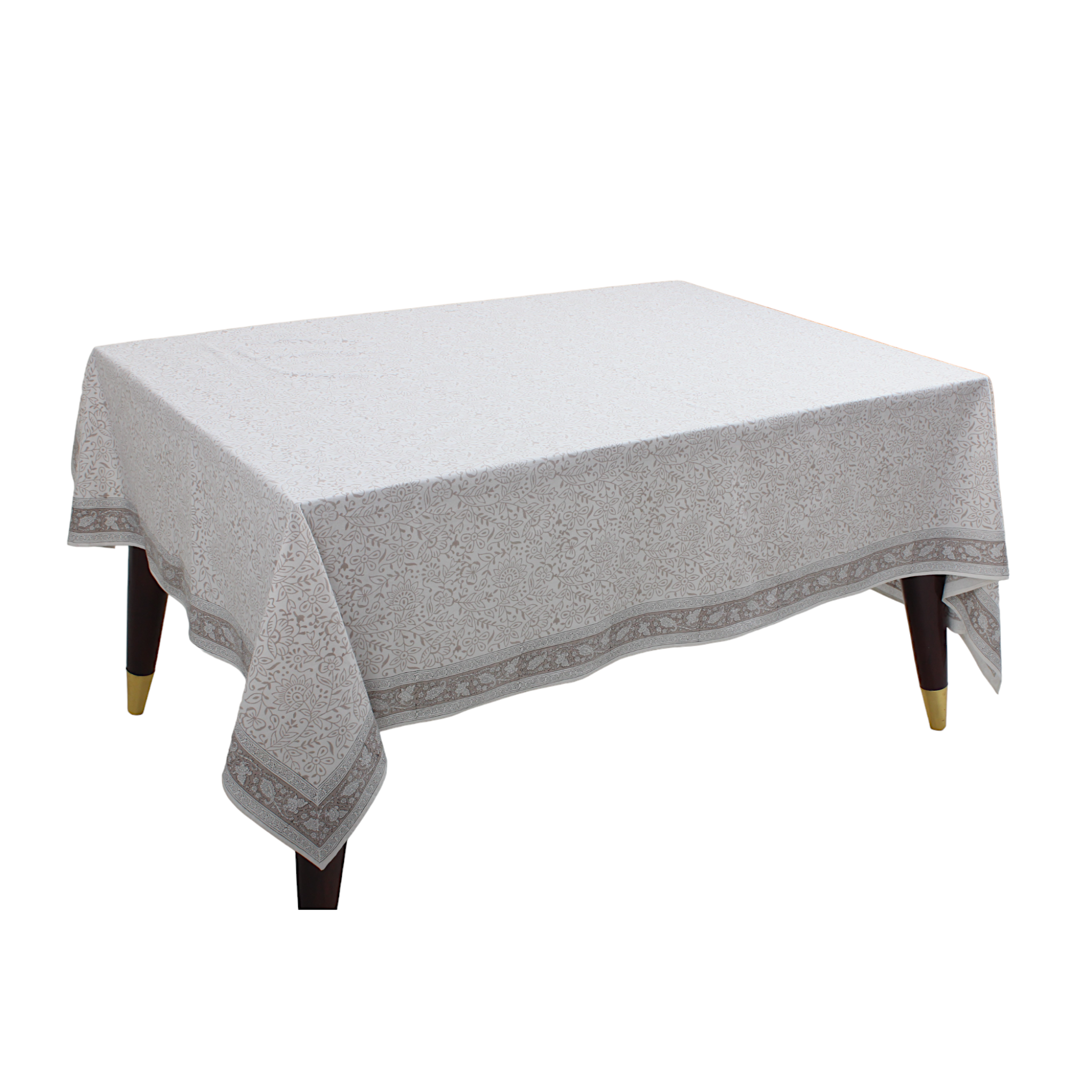 Table with a gray patterned tablecloth on a white background