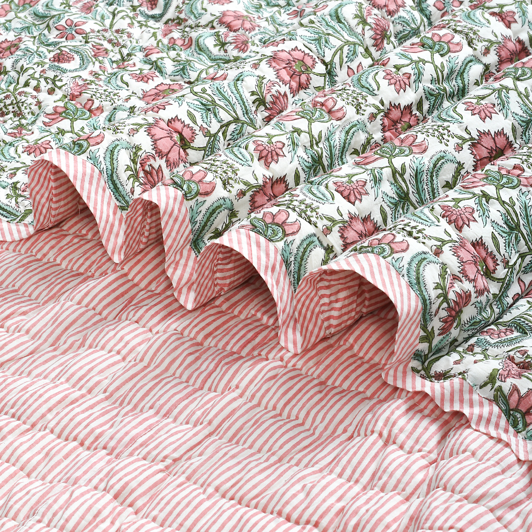 Floral fabric with pink and green pattern on a white background