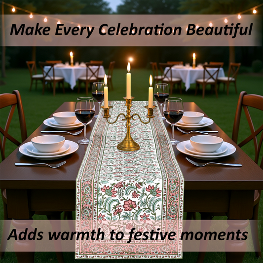 Dining table set for a celebration with a floral table runner, candles, and wine glasses.