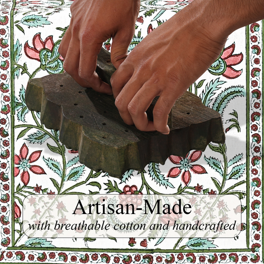 Hands using a wooden tool on a floral patterned background with 'Artisan-Made' text.