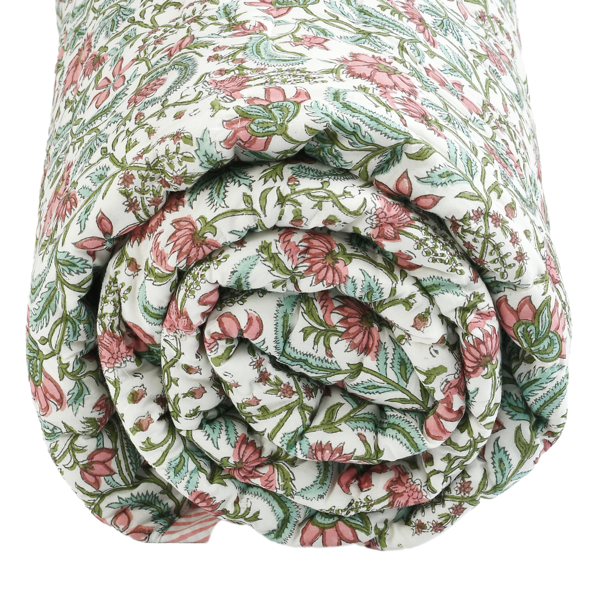 Rolled-up floral quilt with pink and green pattern on a white background