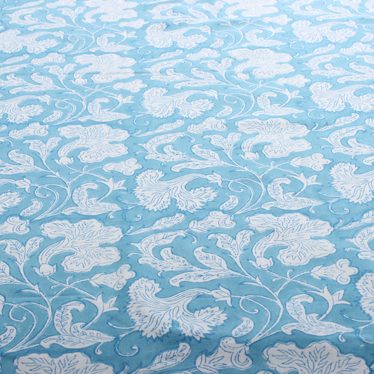 White floral pattern on a light blue background