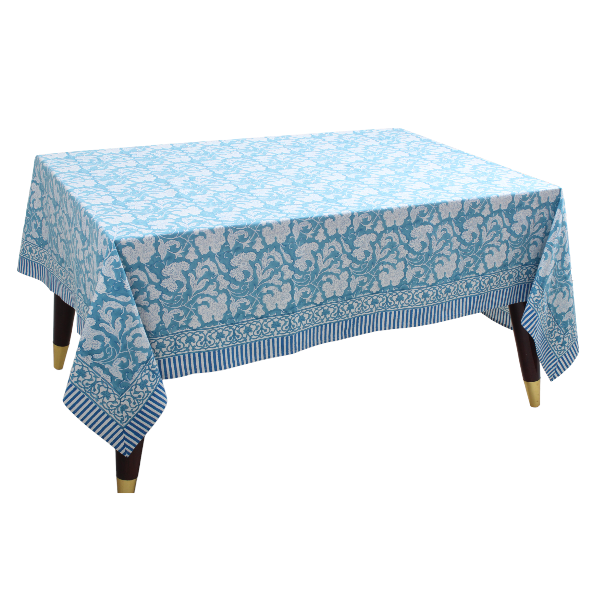 Blue floral patterned tablecloth on a wooden table with white background