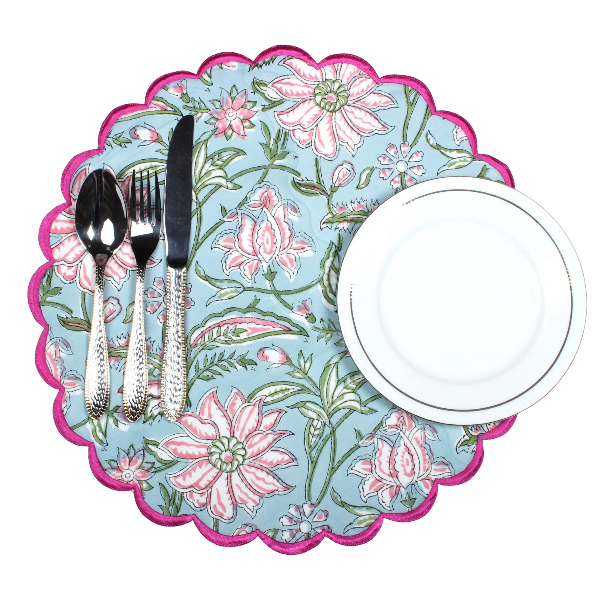 Floral-patterned placemat with cutlery and a plate on a white background