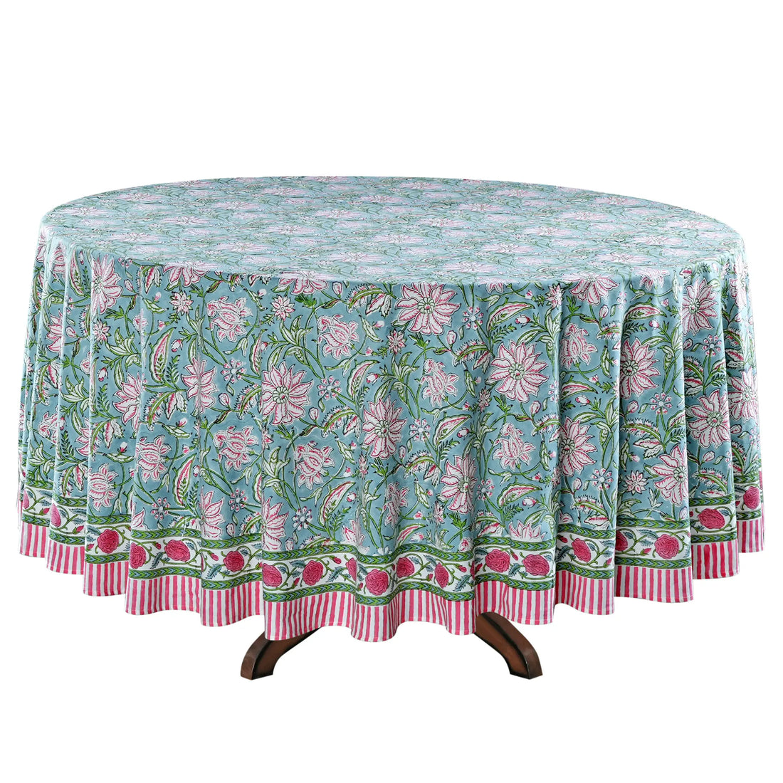 Floral patterned tablecloth on a round table with a white background