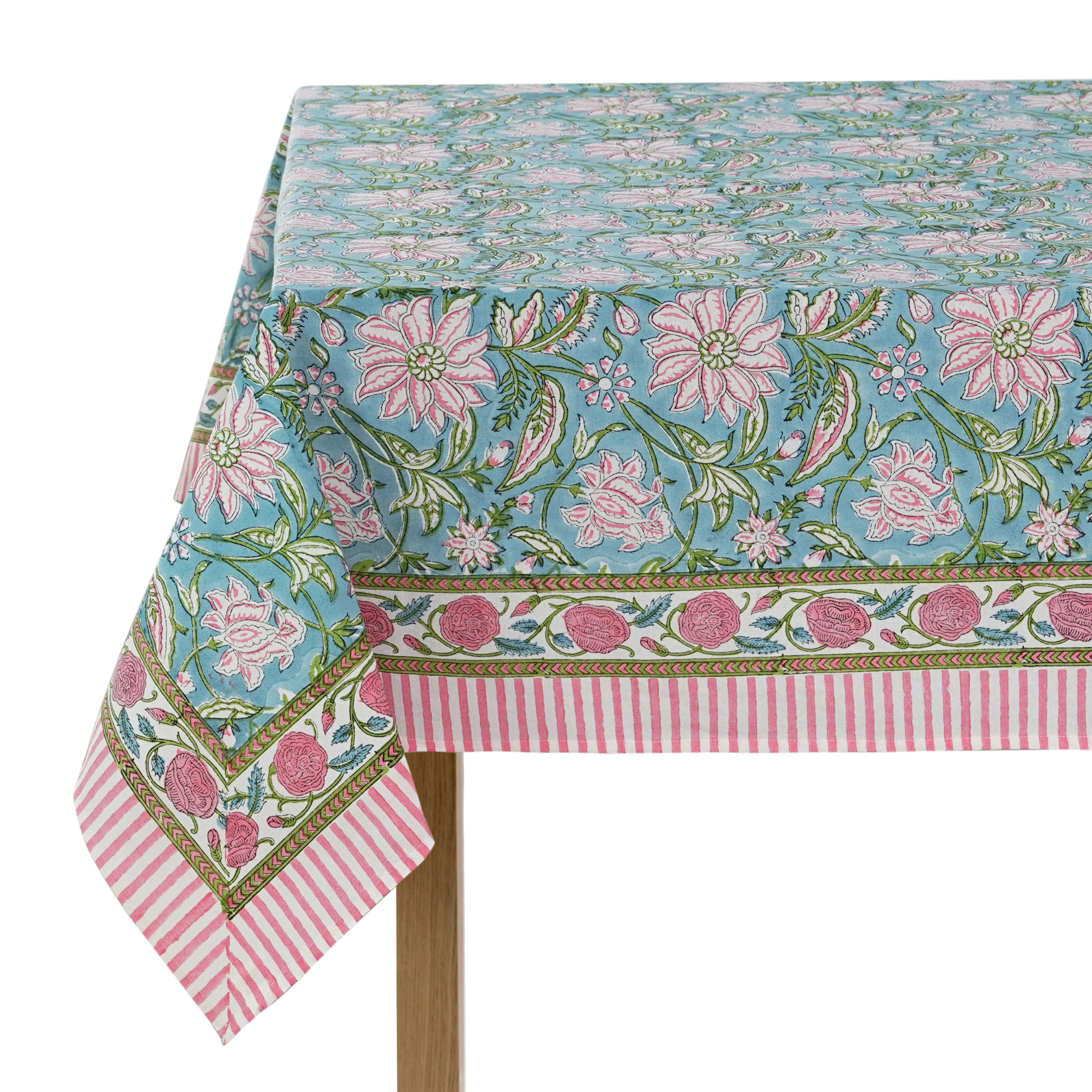 Floral patterned tablecloth with pink flowers and green leaves on a white background