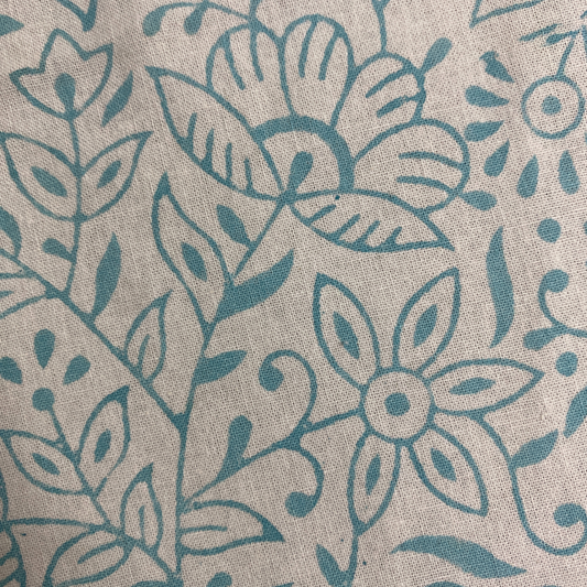 Textile pattern with blue flowers and leaves on a beige background