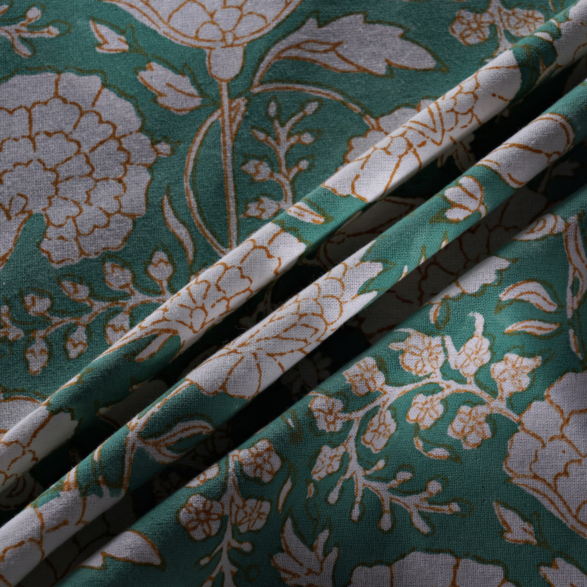 Floral-patterned fabric with green and beige colors