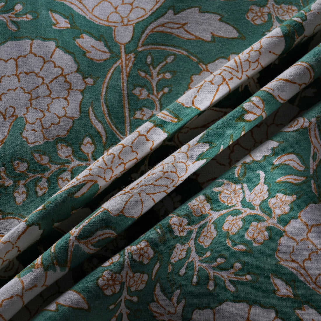Floral-patterned fabric with green and beige colors