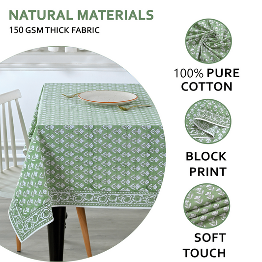 Green patterned tablecloth on a table with text highlighting natural materials and fabric details.