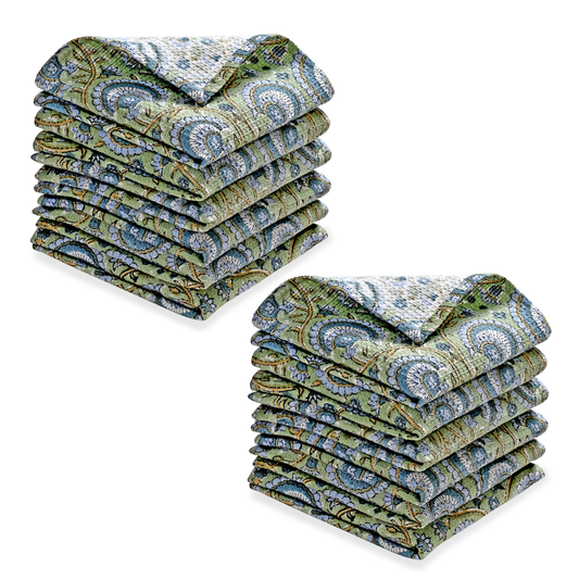 Stack of green and blue patterned folded towels on a white background