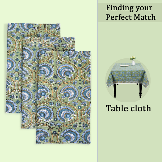 Patterned tablecloth with matching placemats on a light green background