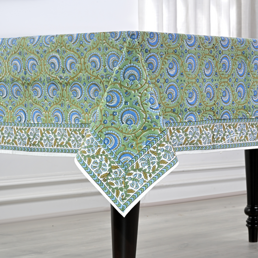 Decorative table runner with green and blue pattern on a white background