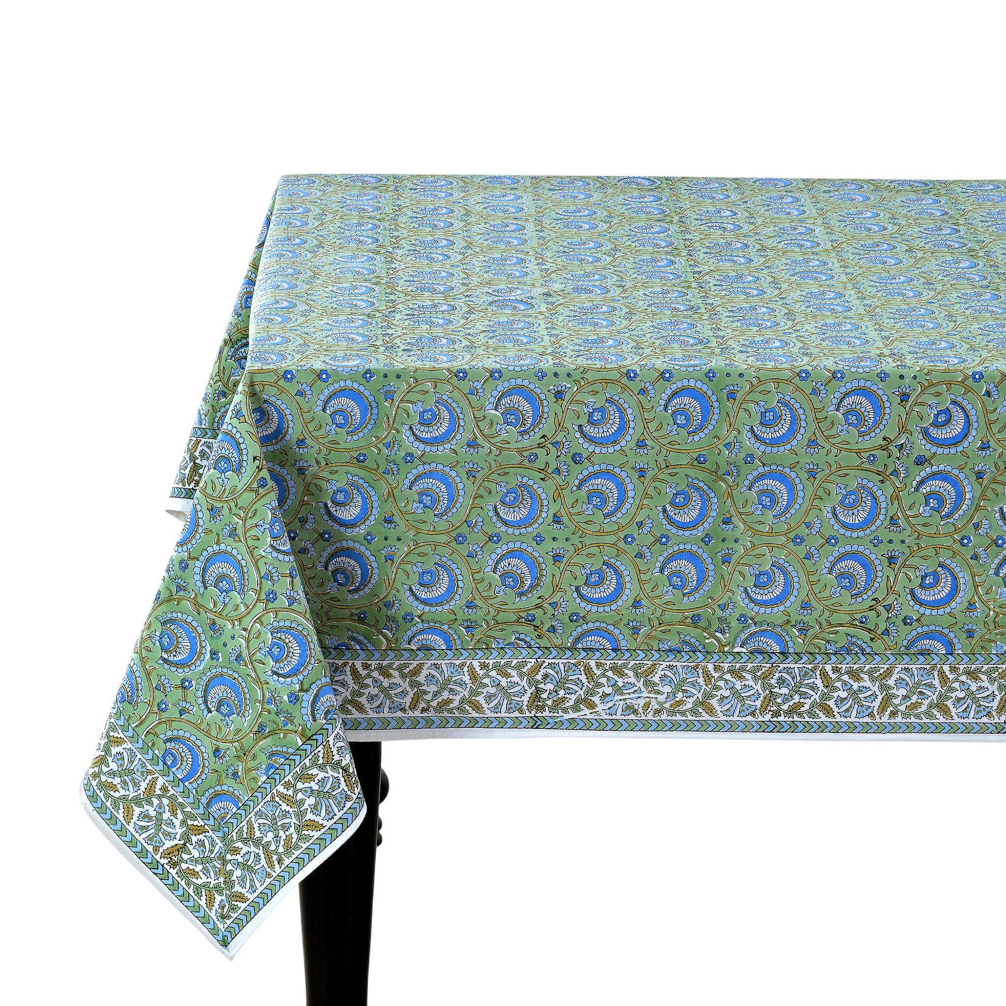 Green and blue patterned tablecloth on a white background