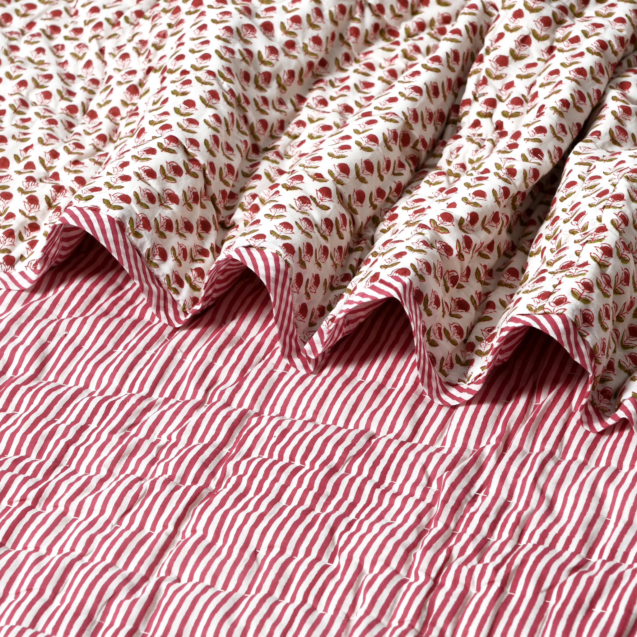 Red and white striped fabric with a floral pattern on top