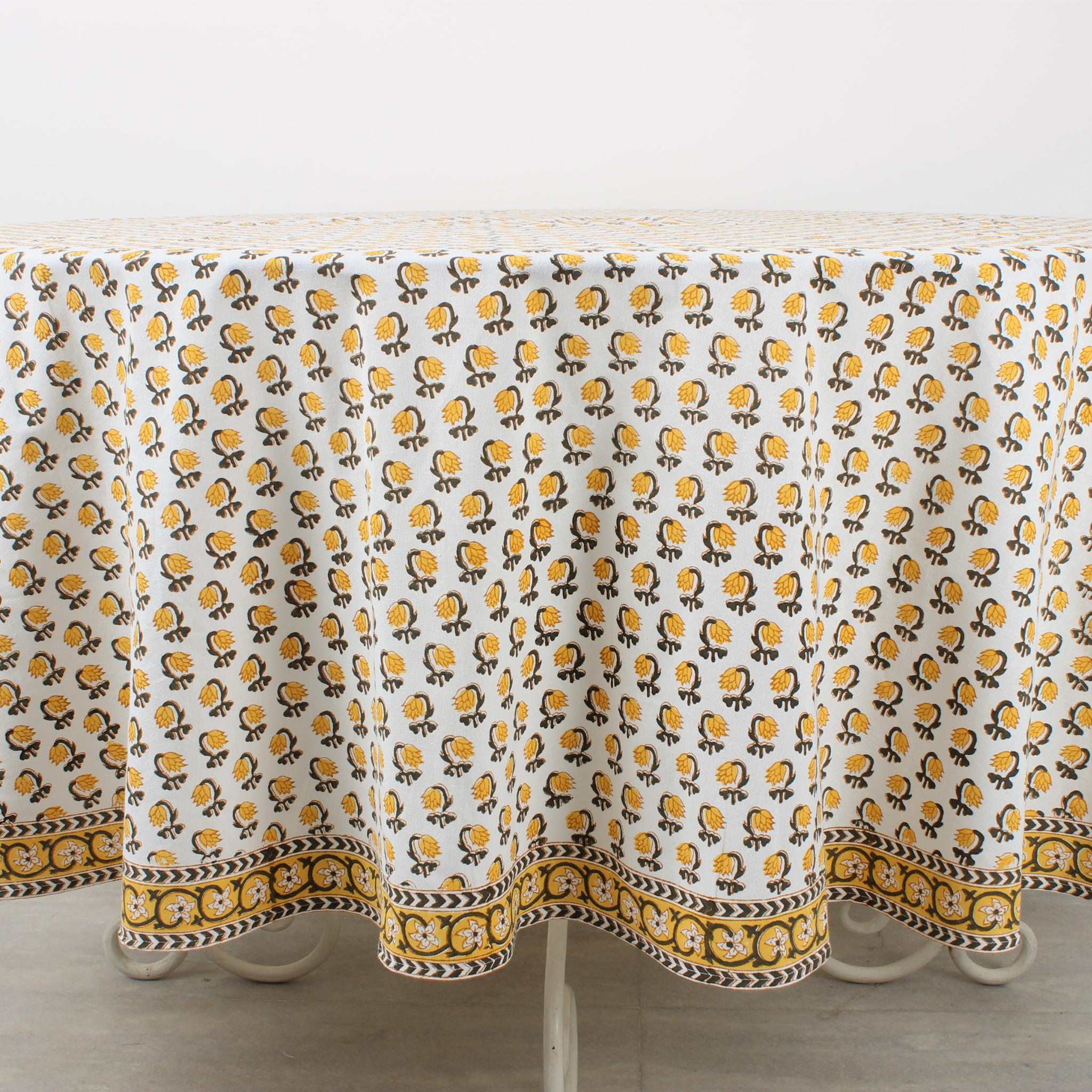 Tablecloth with yellow and black pattern on a white background