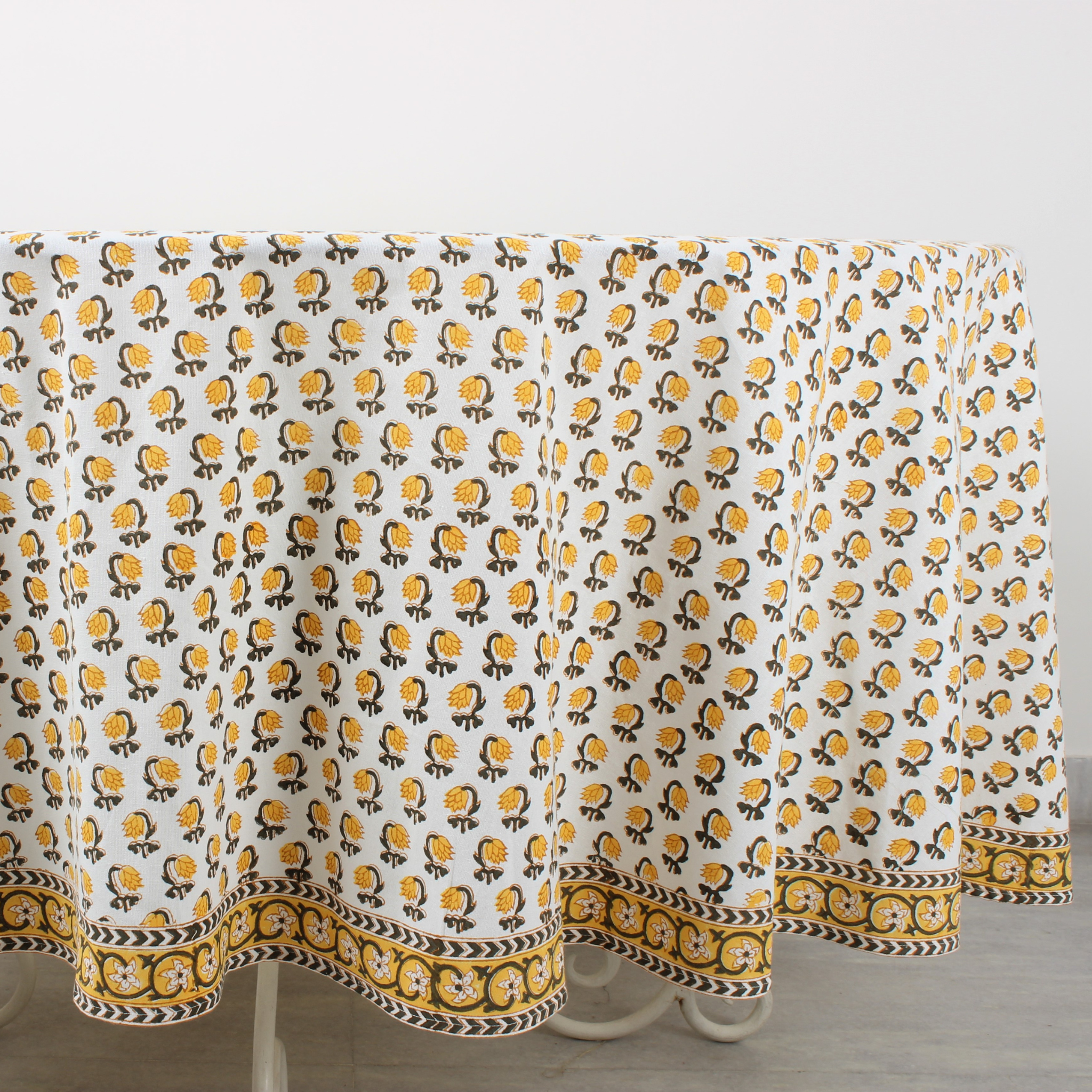 Tablecloth with yellow and black pattern on a white background